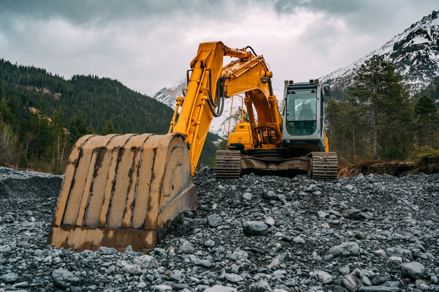 Tracked excavator working across rough rocky ground