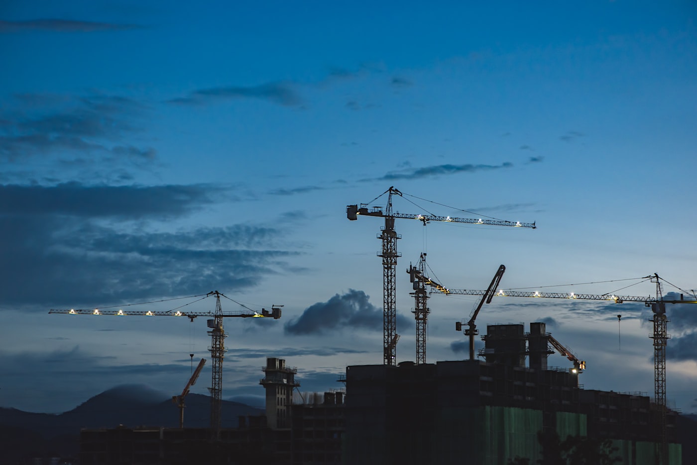 Tower cranes above buildings under construction